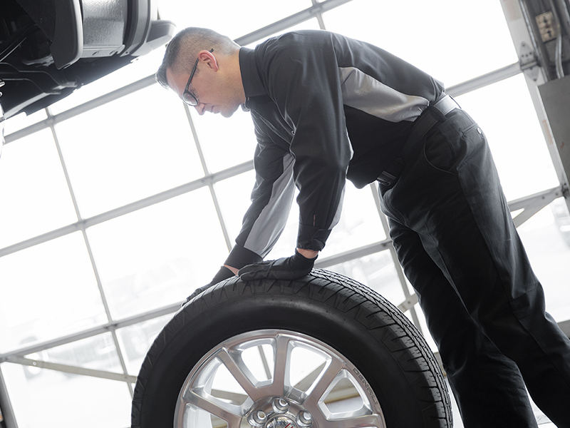 Mechanic inspecting a tire