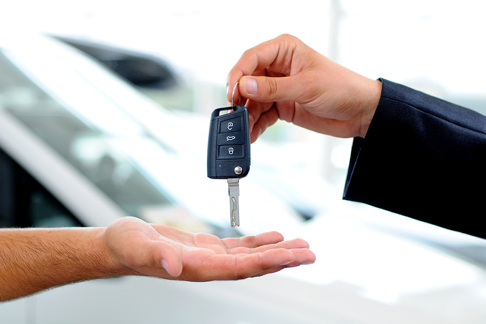 Person receiving a car key