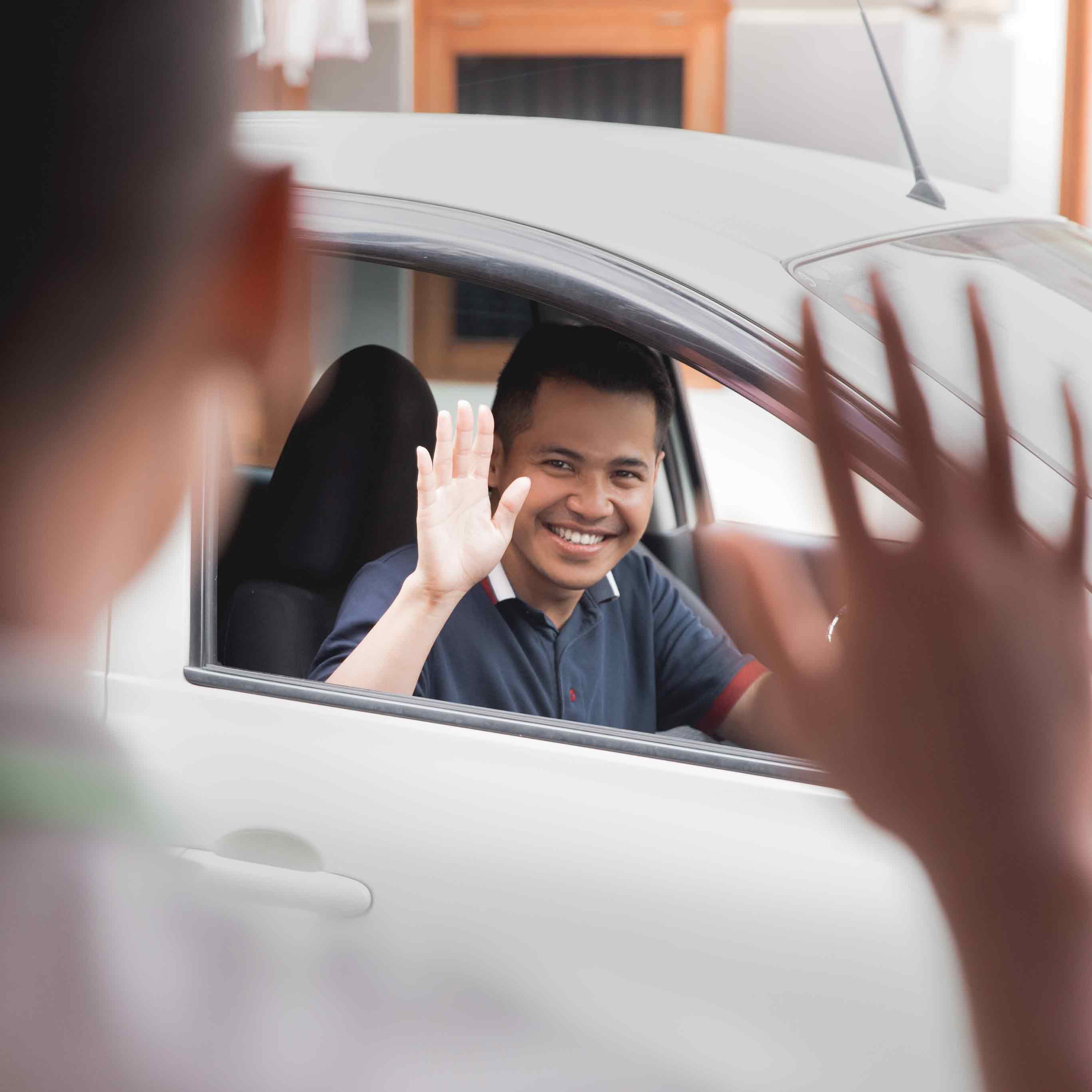 Lancaster Motor Company in Lancaster SC customer waving from his new car 