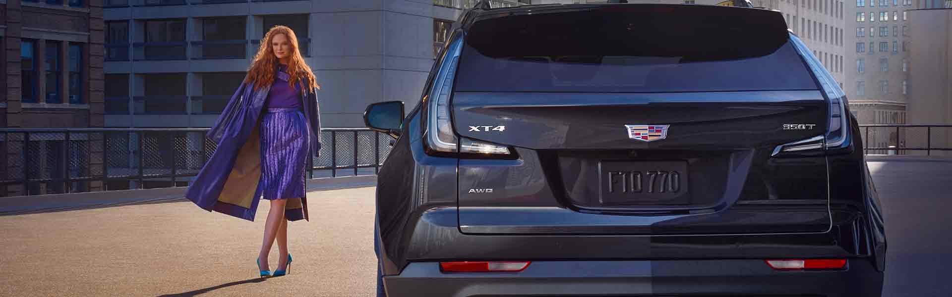 Lancaster Motor Company in Lancaster SC Customer standing next to their Cadillac