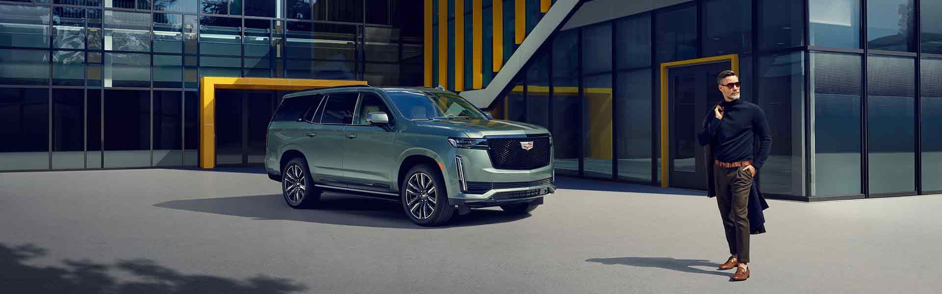 Lancaster Motor Company in Lancaster SC Customer standing next to their Cadillac